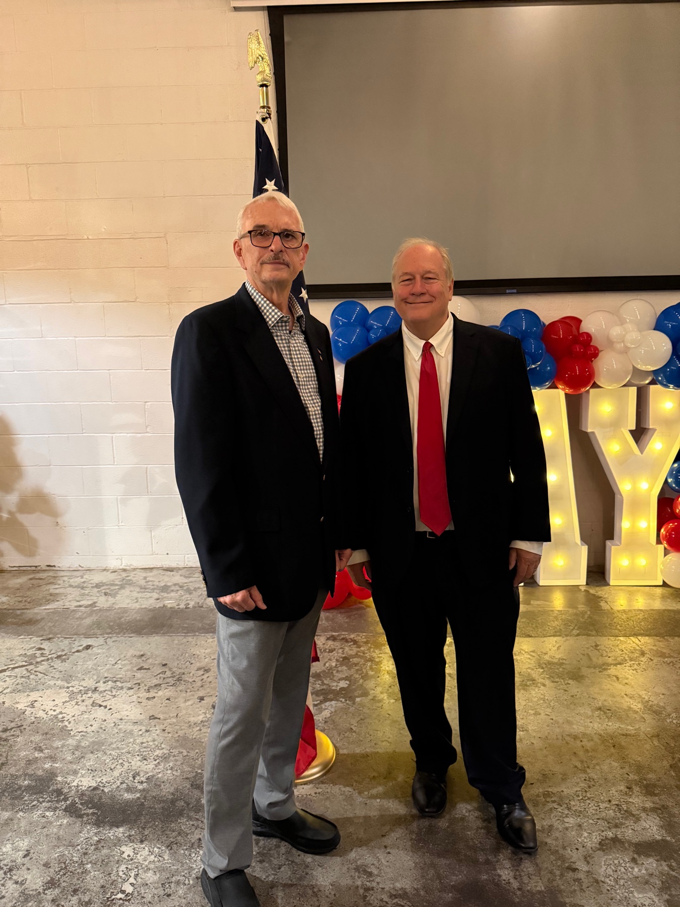 Mike Immler with a community leader at a civic gathering