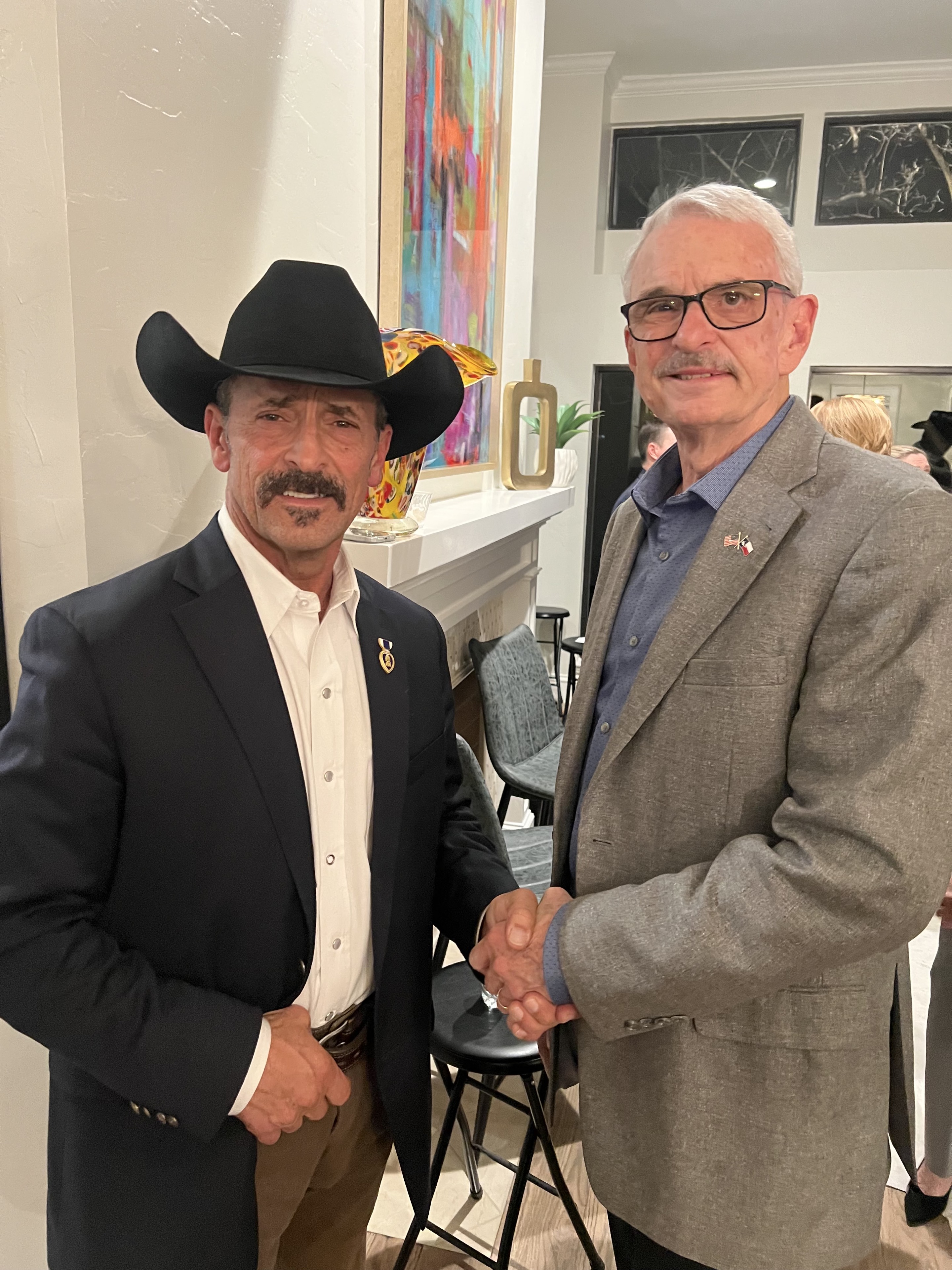Mike Immler meeting a fellow veteran at a community gathering